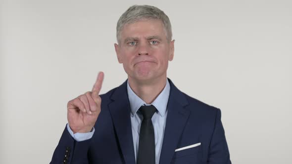 Senior Businessman Waving Finger To Refuse on White Background