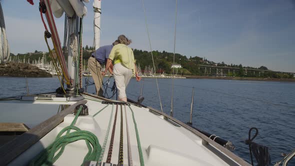 Senior couple on sailboat together. Shot on RED EPIC for high quality 4K, UHD, Ultra HD resolution.