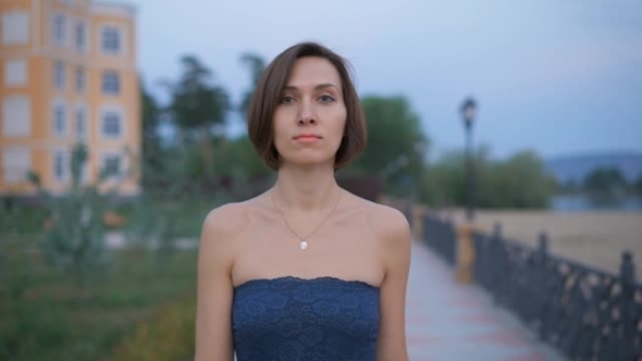 Portrait Of a Young, Attractive Woman In The Street.