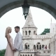 Luxury Couple Hugging And Kissing On The Background Of White Magnificent Ancient Castle - VideoHive Item for Sale