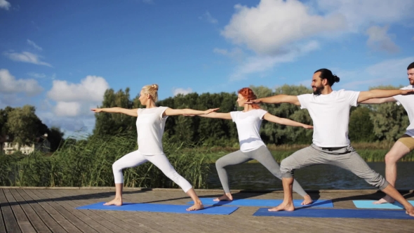 Group Of People Making Yoga Exercises Outdoors 21