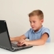 Cute Teen Boy Working On Laptop Computer Or Watching Video In Internet - VideoHive Item for Sale