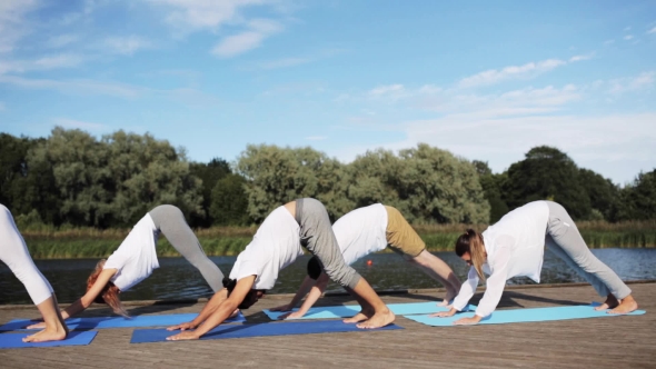 Group Of People Making Yoga Exercises Outdoors 63