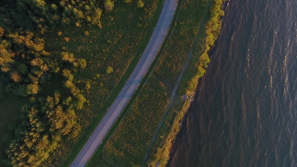 Aerial View To Cliff, Sea And Car Driving On Road 14