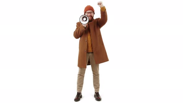 Isolated Shot Middleaged Caucasian Man in a Beanie Holding Megaphone and Shouting About Sales Studio