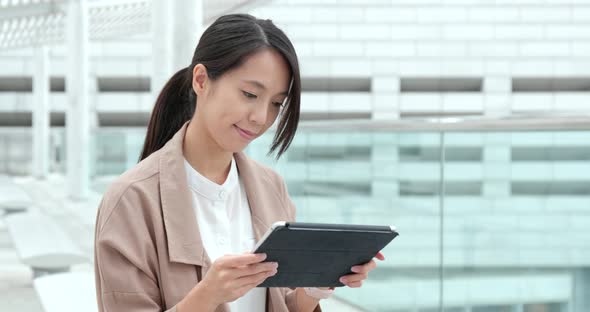 Woman use of tablet computer at outdoor