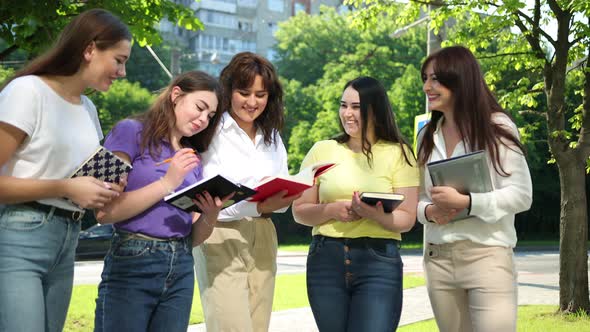 Happy Teens Girls Studying Together Outdoors Enjoying Life