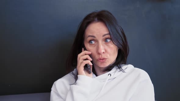 Focused Business Woman Talking on Mobile Phone at Home Office in Slow Motion