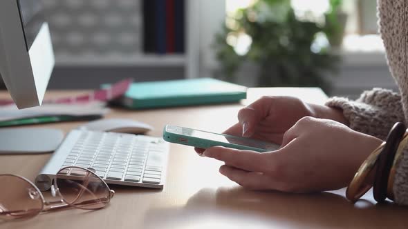 Young Woman Procrastinates Scrolling her Smartphone