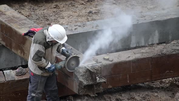 Angular Saw Grinding Through Construction Piles at Construction Site