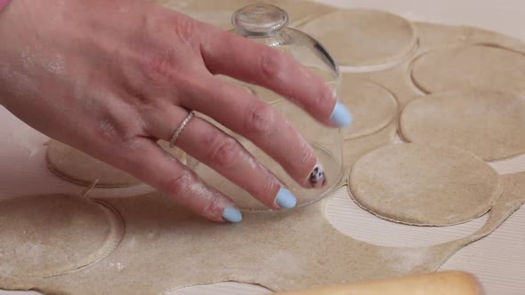 A Woman Prepares Unleavened Bread For The Lord Supper. Forms Bread From Rolled Dough. Close Up