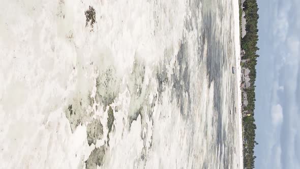 Vertical Video of Low Tide in the Ocean Near the Coast of Zanzibar Tanzania Aerial View