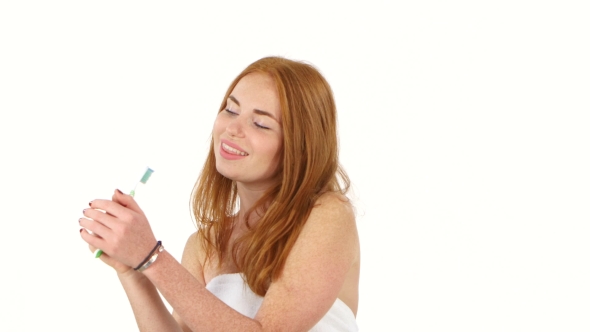 Long-haired Redhead Woman With Ponytail Singing With Toothbrush, Singing
