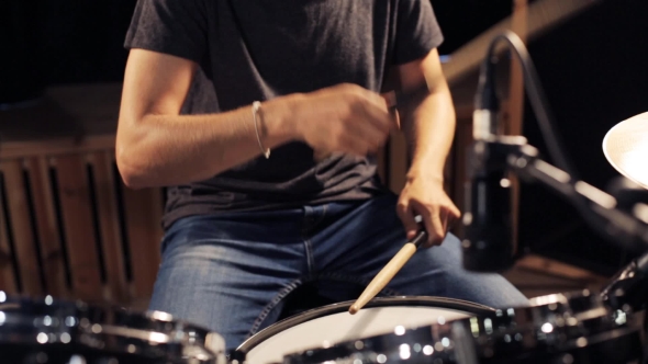 Male Musician Playing Drums And Cymbals At Studio 18