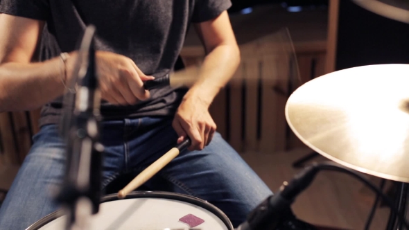 Male Musician Playing Drums And Cymbals At Studio 21