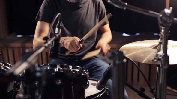 Male Musician Playing Drums And Cymbals At Studio 23