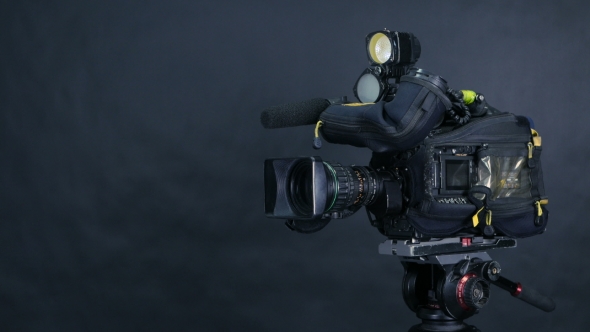 Professional Digital Video Camera, Camcoder Isolated On Black Background In Tv Srudio.