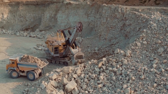 Loading Heavy Dump Truck At The Opencast Mining Site