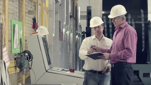 Engineer Asking Colleague To Sign Up Documents