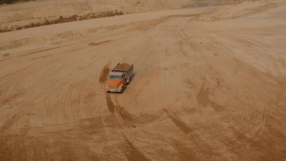 Truck Loaded With Sand Going Through The Sand Shaft. Aerial Video alt