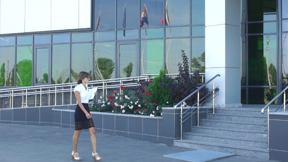 Beautiful Businesswoman Goes To The Office The Stairs