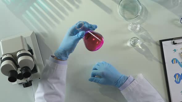 Cosmetic Laboratory Scientist Composing Mixtures to Neutralize Acidity, Top View