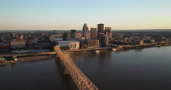 Louisville, Kentucky skyline with bridge and with drone video moving down.