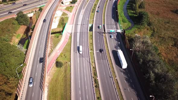 Truck on the road. Large delivery truck ising towards crossroads. Aerial shot.