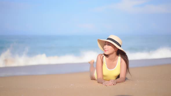 Asian woman enjoy around beautiful beach sea ocean