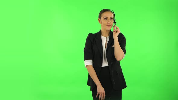 Smiling Happy Business Woman with Headset Helping with Customer Service. Green Screen