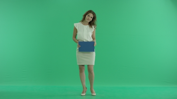Woman Showing a Blue Screen On a Green Background