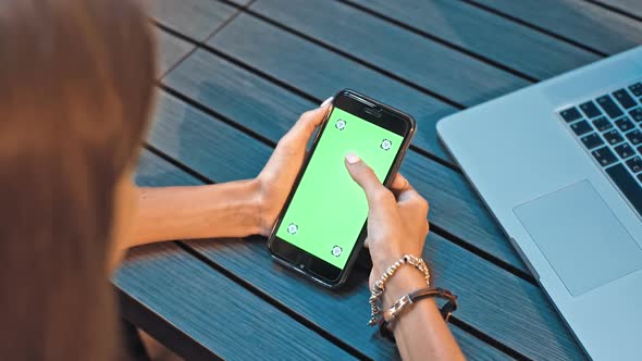 Woman Holding Green Screen Smartphone