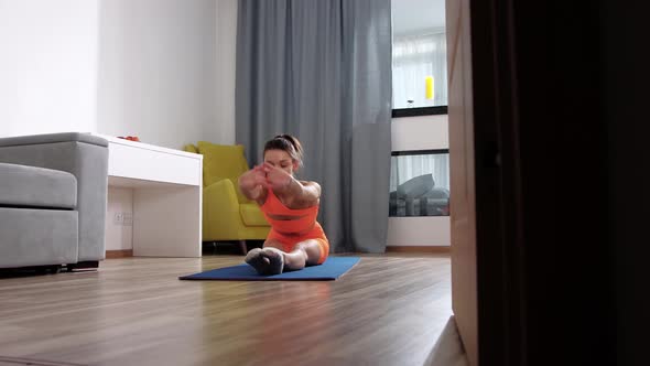 Fitness at Home  Young Woman Doing Fitness in the Room