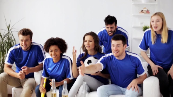 Friends Or Football Fans Watching Soccer At Home