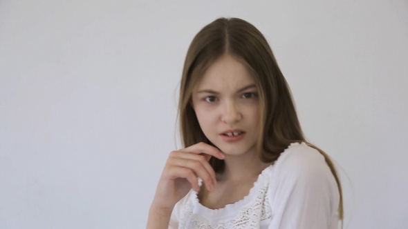 Pretty Model With Gap Between Front Teeth Poses In Front Of Camera