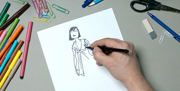 Man Draws a Female Figure On a Piece of Paper