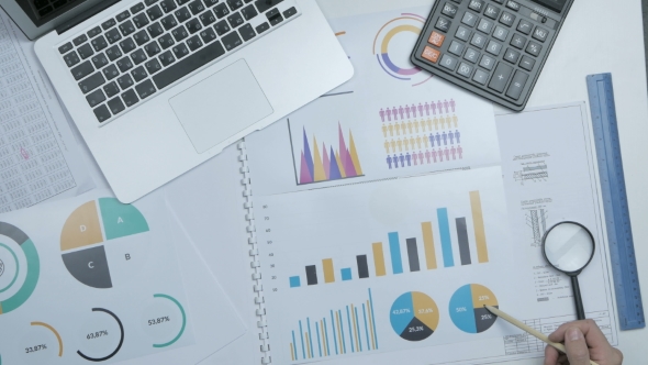 Financial Specialist, Businessman Working With Blueprint, Graph At His Workplace.