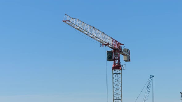 Construction Crane is Working on a Construction Site