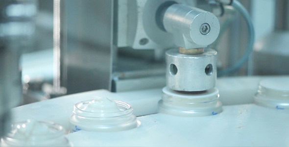 Cream Glass Recipients On A Production Line