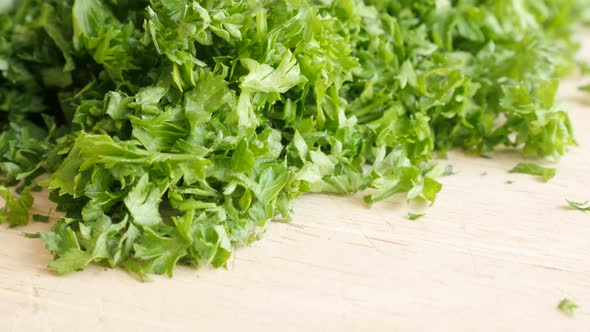 Parsley vegetable plant cutted on  smaller pieces 4K 3840X2160 UltraHD tilt footage - Petroselinum c