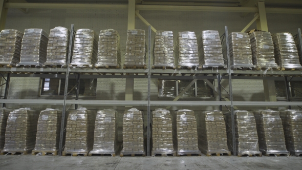 Large Furniture Warehouse. Mezzanine Shelving With Large Packages Of Food Ready For Dispatch