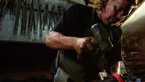 Blacksmith working on a iron rod