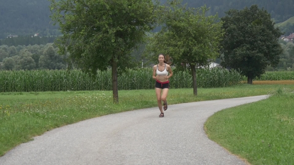 Young Woman Makes a Morning Jog