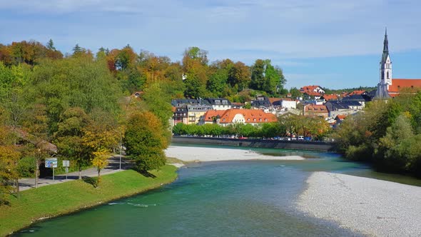 Golden Autumn in Famous Tourist Landmark Medieval Town Bad Tolz. View of Isar River, Trees, Downtown