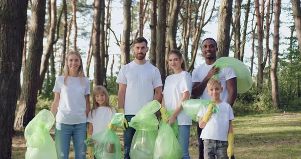 Group of Youth and Children Posing on Camera After Cleaning the Park from Scattering Rubbish