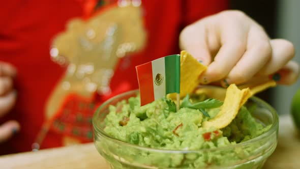 The Girl Tasted the Guacamole Sauce with a Nachos