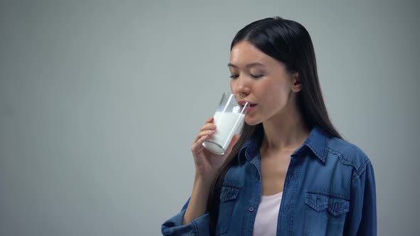 Smiling Woman Drinking Glass of Fresh Milk, Lactose-Free Dairy Products, Calcium