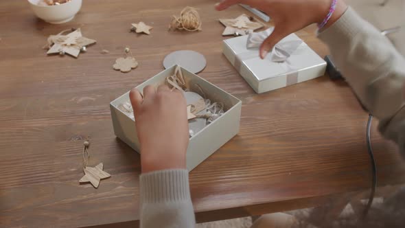 Girl Preparing Christmas Present