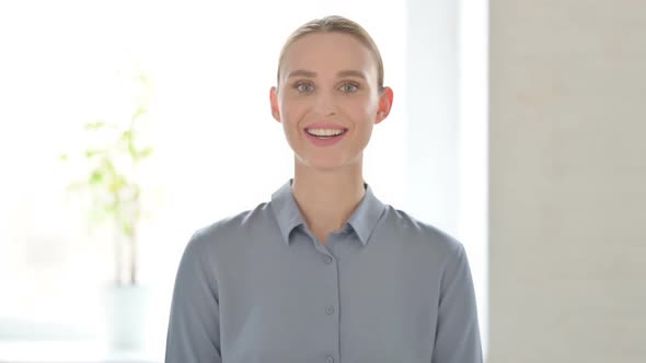 Portrait of Woman Shaking Head As Yes Sign Approval