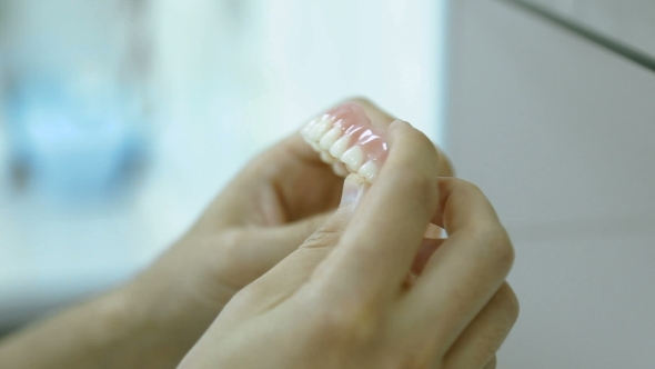 Dental Plates In The Hands